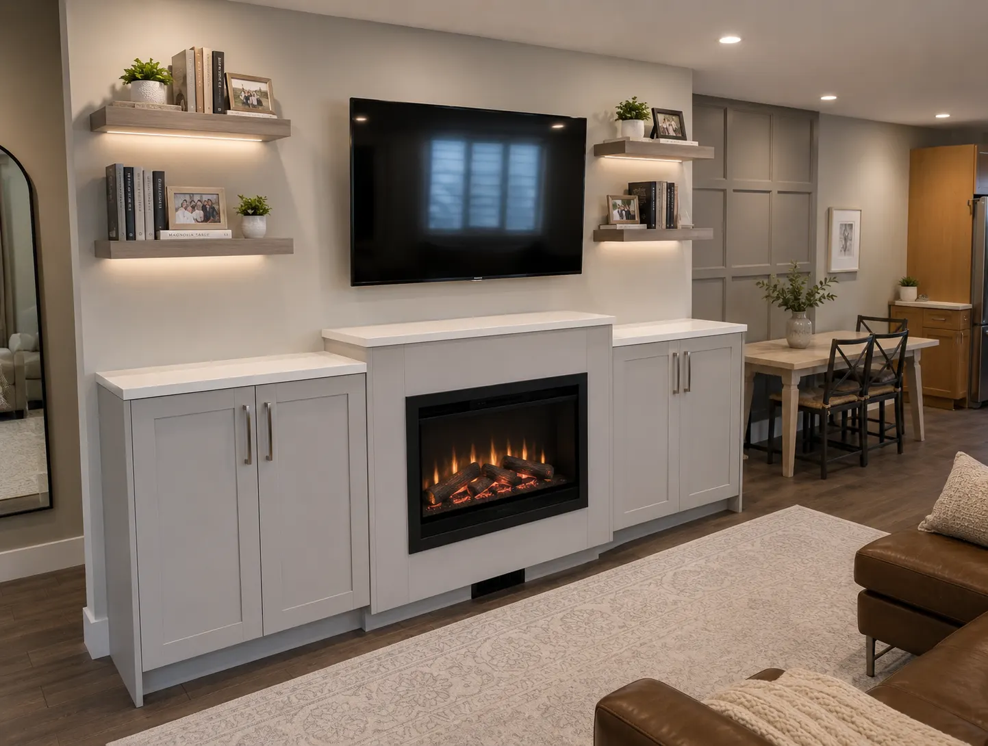 Built-in fireplace millwork in a Hillhurst renovation, Calgary — shaker base cabinets, a quartz top and lit floating shelves