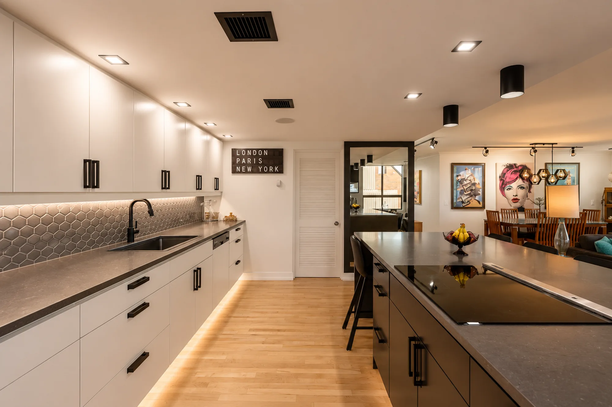 Open kitchen with a custom island and stone counters from the Mission kitchen and ensuite renovation in Calgary